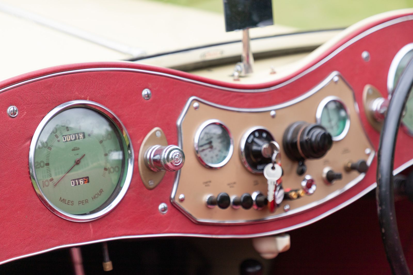 Classic MG dashboard with round gauges and a large steering wheel